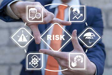 Manager using virtual touch screen sees word: RISK. Concept of risk management and mitigation to...