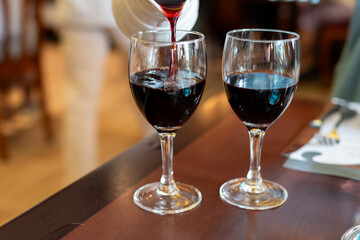 Red dry wine in glasses, lunch with wine in France,  Limouges, France