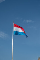 Views of flag of Luxembourg country and blue sky  in Luxembourg or Luxembourg City capital city and one of de facto capitals of European Union