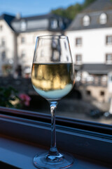 White quality riesling wine served in old restaurant in Vianden, Luxembourg