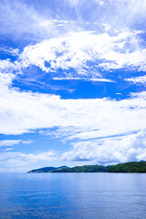 Tropical islands on a sunny, blue sky. Portrait. Romblon Island, Philippines