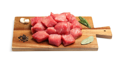 Pieces of raw beef, bay leaves, garlic, rosemary and peppercorns isolated on white