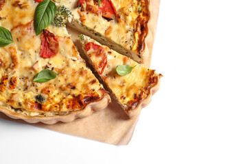 Tasty quiche with tomatoes, basil and cheese on white background, top view. Space for text