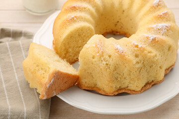 Delicious freshly baked sponge cake on table, closeup