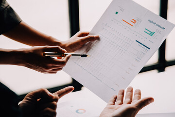 Businesswoman or accountant working Financial investment on calculator, calculate, analyze business and marketing growth on financial document data graph, Accounting, Economic, commercial concept.