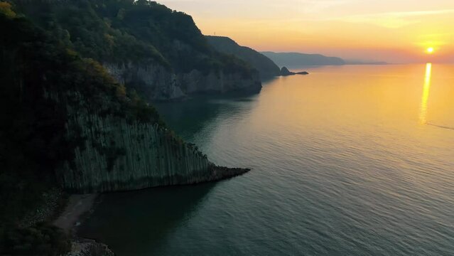 Lava landscape and the Black Sea. Guzelcehisar is famous for its lava basalt columns. The columns were viewed with a drone at sunset. Amasra, Bartin, Turkey