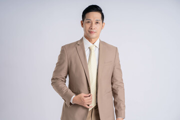 Image of Asian male businessman posing on white background