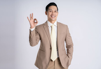 Image of Asian male businessman posing on white background