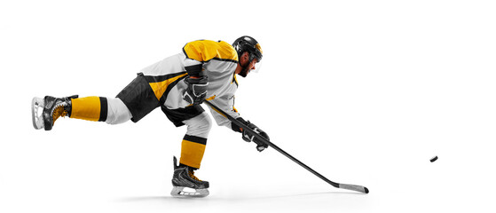 Athlete in action. Sports emotions. Hockey concept. Professional hockey player playing hockey on a white background © Ruslan Shevchenko