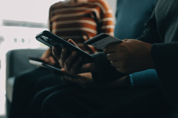 Close up of woman hand using credit card and laptop for payment and online shopping, Online shopping, payments digital banking, E-commerce concept.