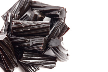 Classic Black Licorice Pieces Isolated on a White Background