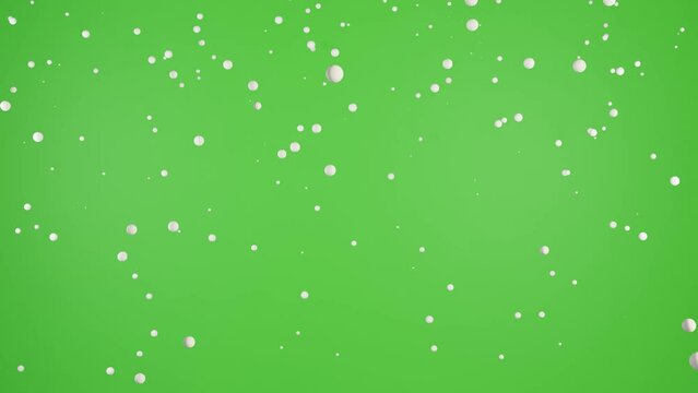 Isolated falling snow on green screen