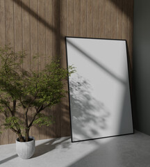 big wooden frame mockup poster leaning on the wooden panel wall with tree plant decoration