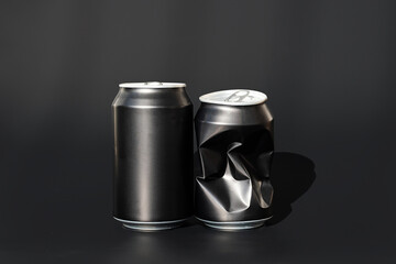 Two used aluminum beverage cans. Black soda can mock up.