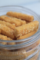 Indonesian cookies called kastangel  in a jar on the table 