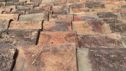 traditional Indonesian clay roof tiles. old roof tiles made of clay. side view.