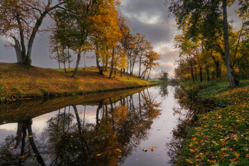 A small river in autumn colors, near the town of Pasłek, Warmian-Masurian Voivodeship, Poland