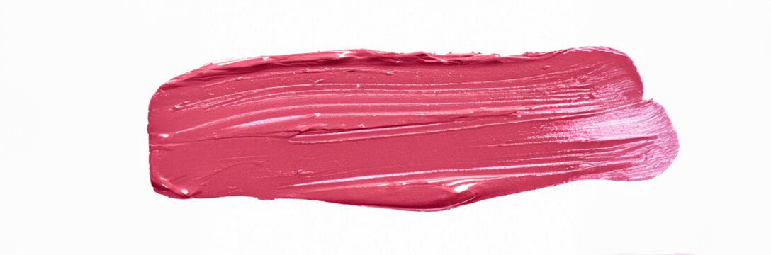 Pink Lipstick smear smudge swatch isolated on white background. cosmetic product brush stroke swipe  on the wall