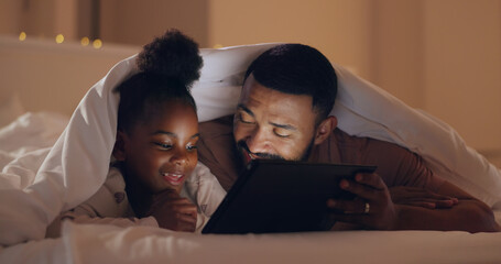 Father, daughter and tablet at night with internet for movie, cartoon or streaming with blanket on bed in bedroom. Family, man and girl child with technology in the dark for film, video and bonding