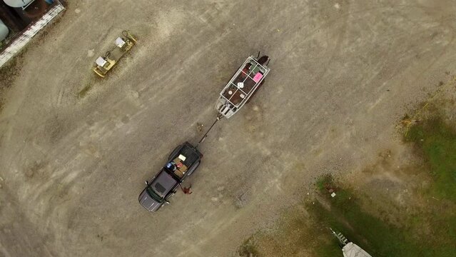 Aerial Top Panning Shot Of People Walking Around Pickup Truck Parked On Road - Bayou, Louisiana