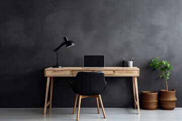 minimalistic home workplace with wooden desk and a dark grey wall