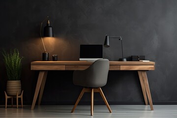 minimalistic home workplace with wooden desk and a dark grey wall