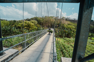 A suspension bridge that can only be used by two-wheeled vehicles and can only be crossed in turns....