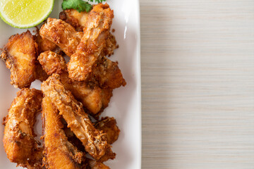 Fried Snapper Belly on white plate