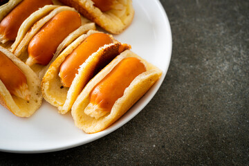 flat pancake roll with sausage