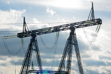 High voltage pylon against a blue sky