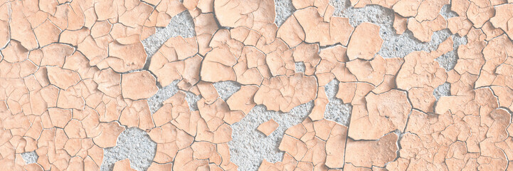 Yellow peeling paint on the wall. Old concrete wall with cracked flaking paint. Weathered rough painted surface with patterns of cracks and peeling. High resolution texture for background and design.