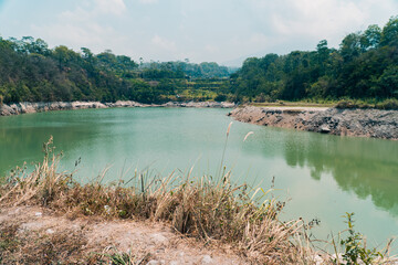 Aerial photo of a river that resembles a lake during the long dry season. Drone photo showing a clear river that doesn't flow until it finally becomes a puddle that resembles a lake
