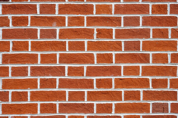 Background from a red brick wall with white joints