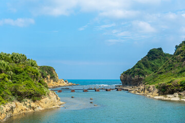The landscape of the coast at Heping Island Park in Keelung City, Taiwan, Keelung, Sky and sea horizon, Bridge across the sea.
