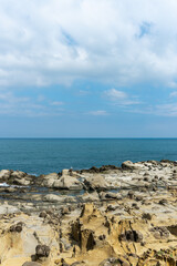 Fototapeta na wymiar The landscape of the coastal rock at Heping Island Park in Keelung City, Taiwan, Sky and sea horizon.