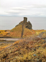 Two brothers rocks near Cape Zemlyanoi on the Kola Peninsula. Natural weathering pillars. The rocky coast of the Barents Sea. The ancient sanctuary of the Sami. Arctic Russia.