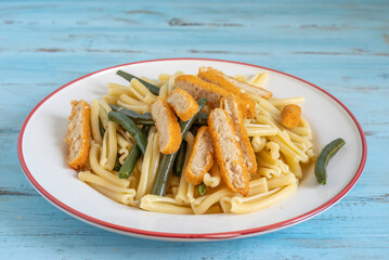 Crusted Chicken and Green Beans Pasta on ceramic plate.