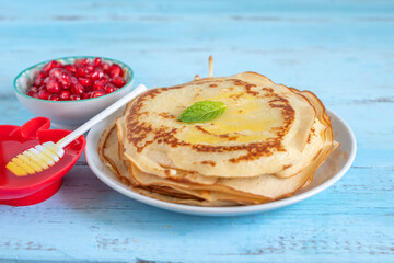 Pancakes with fresh honey for Jewish holiday Rosh Hashanah.