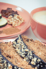 Pastry made of zucchini and cup of white coffee. Delicious dessert. White background