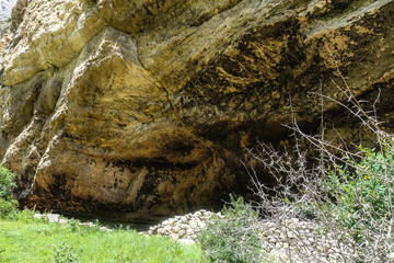 The picturesque gorge of the Jylgy-su river. The Caucasus Mountains near the ancient city of Eltuby. Next to the grotto with an ancient human parking lot.