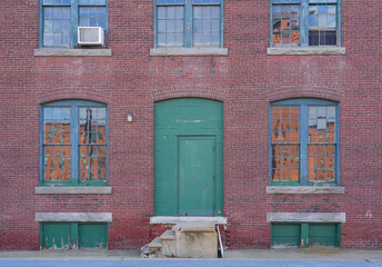 Fototapeta na wymiar facade view of old factory building with red brick wall