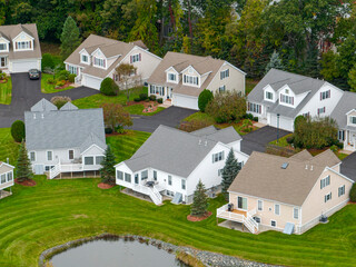 aerial drone view of neighborhood street with single family homes