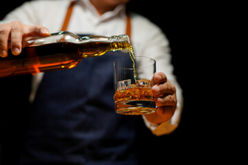Bartender Serve Whiskey, on wood bar,  - obrazy, fototapety, plakaty