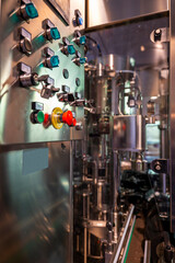 Automated Wine Bottling on Conveyor Belt in Factory in Switzerland.