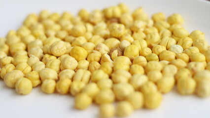 Dried chickpeas on white background. Souvenirs for returning from Hajj or Umrah.