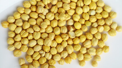 Dried chickpeas on white background. Souvenirs for returning from Hajj or Umrah.