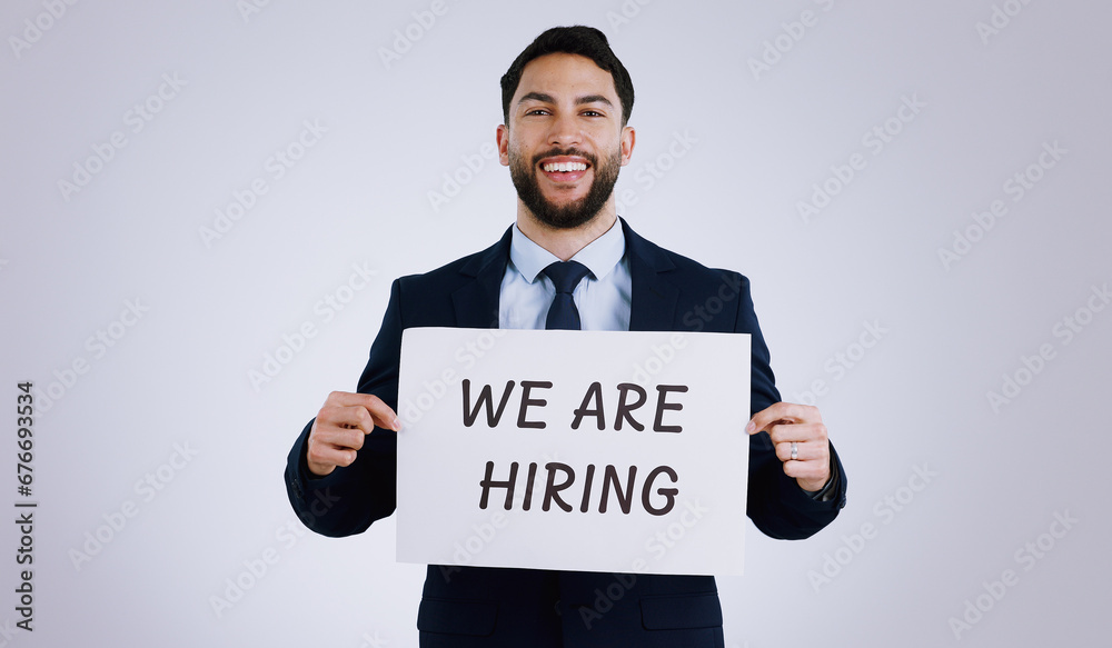 Sticker Happy businessman, portrait and hiring sign for opportunity, advertising or marketing against a gray studio background. Man smile with billboard or poster for recruiting, interview or career position