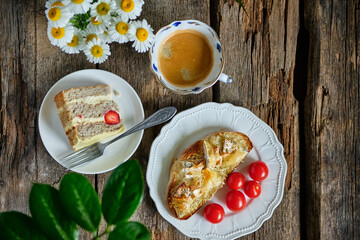 Breakfast. Piece of strawberry cake and grilled camembert toast