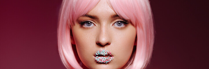 Glamorous portrait of a young woman with pink hair and glitter on her lips. A Chic Expression of...