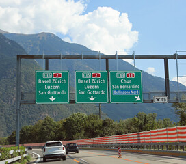 road signs on the motorway with directions to many locations in Switzerland